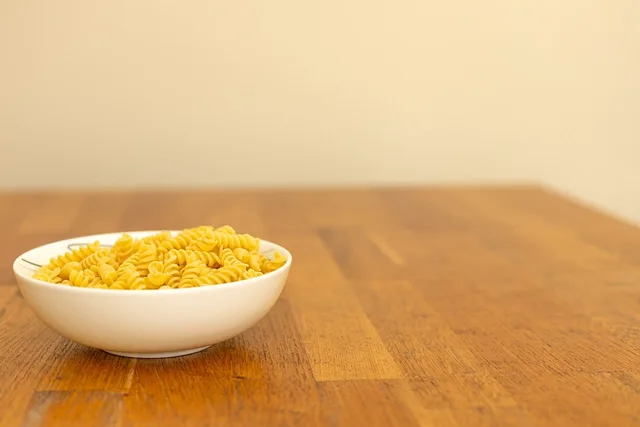 pasta, fusilli, bowl, raw, ingredient, italian, wood, table, cooking, dry, vegetarian, nutrition, homemade, recipe, yellow, carbohydrate, culinary, meal, food storage, kitchen, pantry. How long does a pantry organization project really take?
