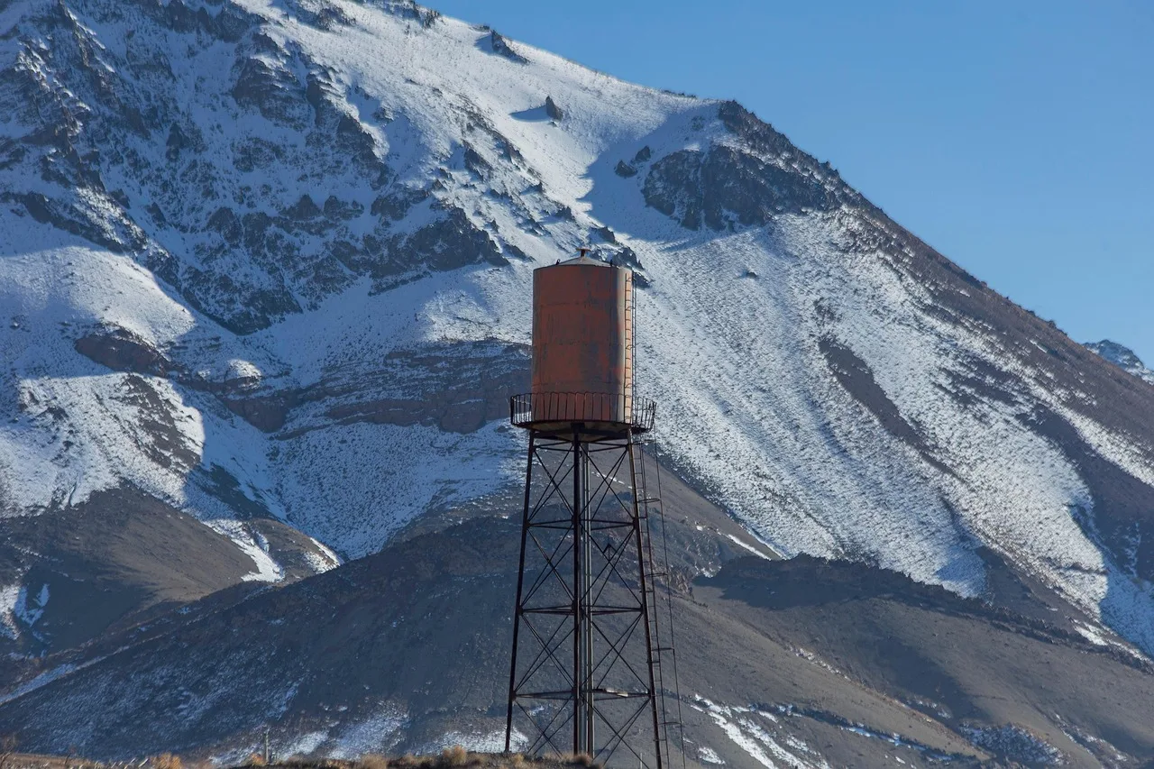 water tower, mountain, snow, winter, water tank, structure, landscape, countryside, rural, nature, tafresh, markazi province, iran. Climate and organization costs: dehumidifiers, pest control, freeze losses