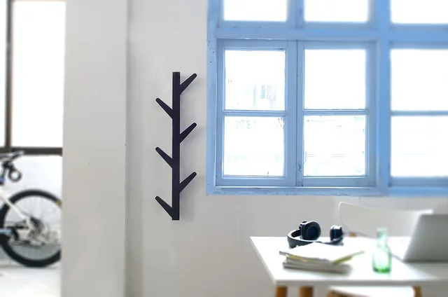 study, wall-mounted hook, room. Wall-hung rails, towers, wire kits, and freestanding wardrobes compared by failure mode